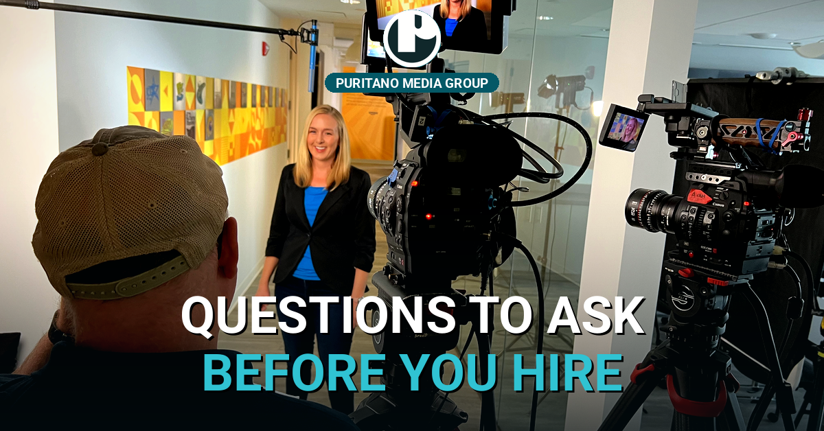A PMG two-camera interview setup filming a speaker on a production set